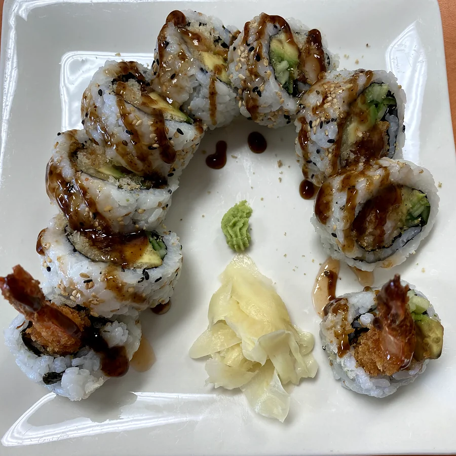 Dynamite roll with tempura shrimp, avocado and cucumber, topped with sweet sauce, with ginger and wasabi at Hana Sushi, Winnipeg
